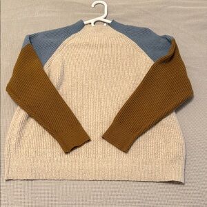 Lush Beige Sweater with Blue and Brown Sleeves